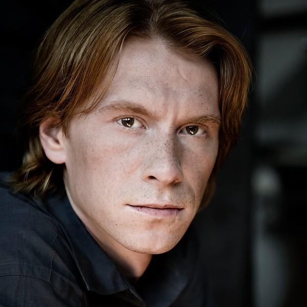 headshot of Sergey Antonov, cellist