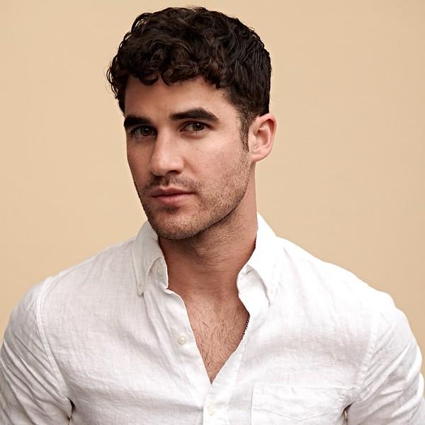 Image of man with dark hair and white shirt